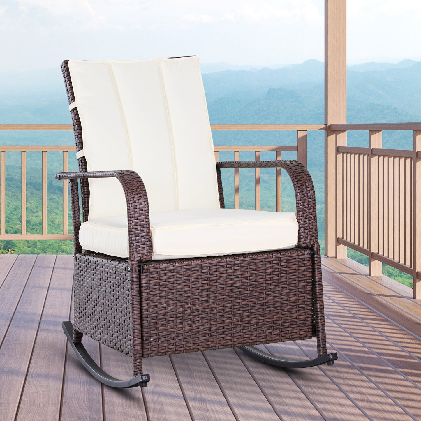 Brown wicker rocking chair with cream cushions on a wooden deck