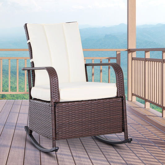 Brown wicker rocking chair with cream cushions on a wooden deck