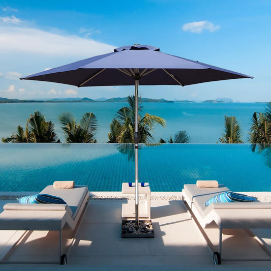 Large navy blue patio umbrella providing shade over an infinity pool