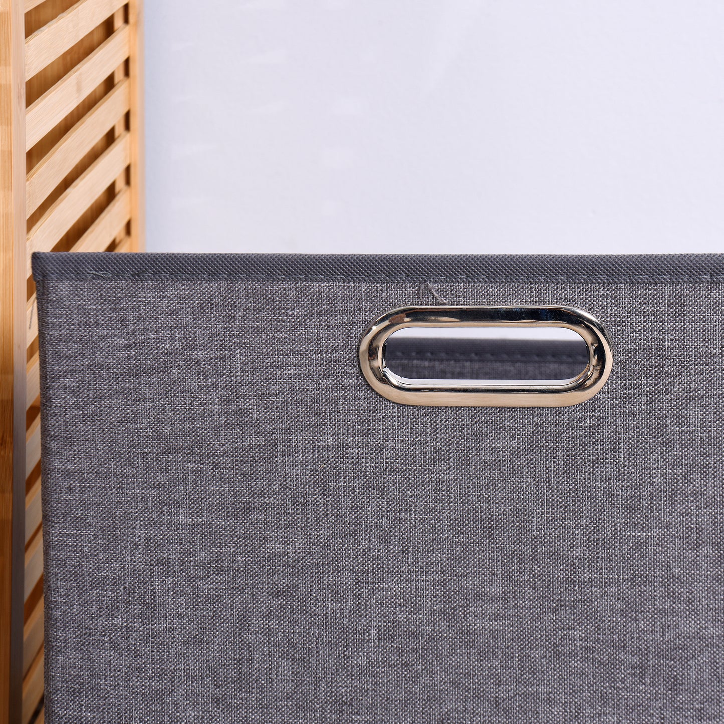 Gray fabric storage bin with silver oval handle perfect for organization