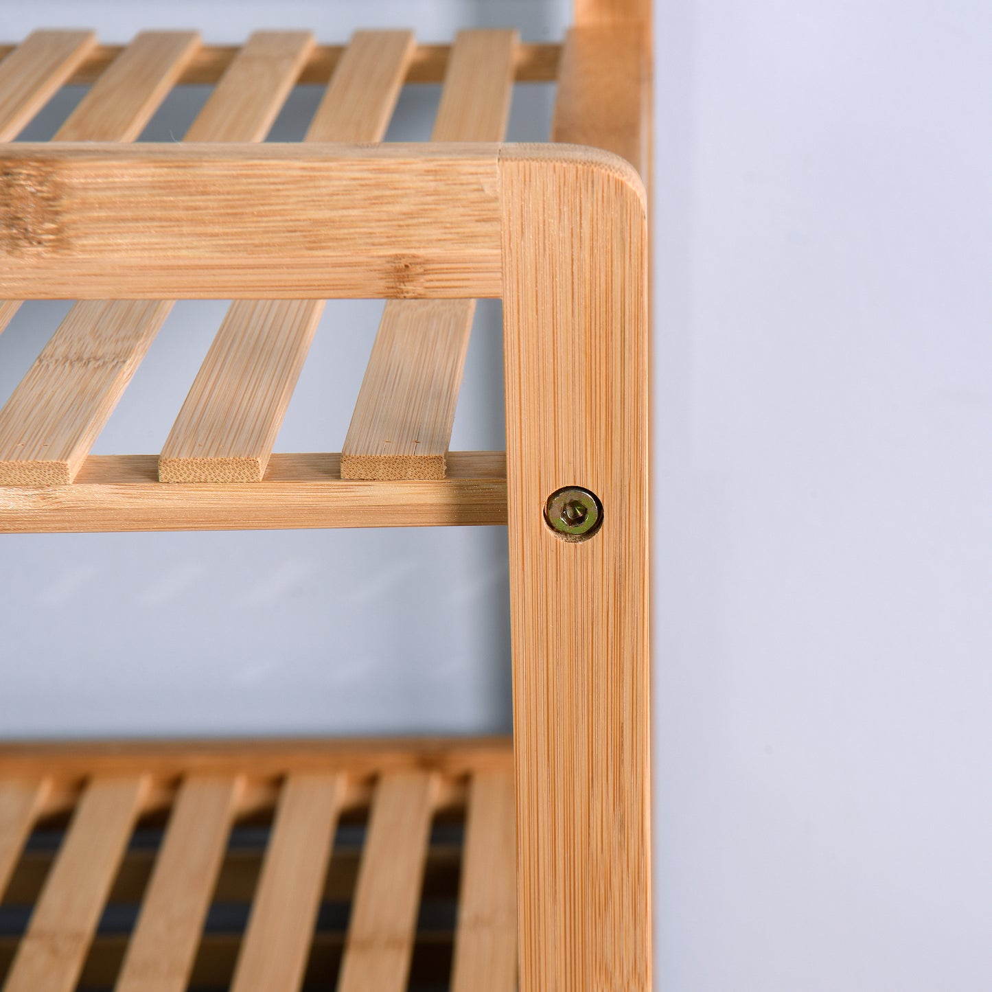 Natural bamboo bathroom shelf with slatted shelves and a visible screw detail