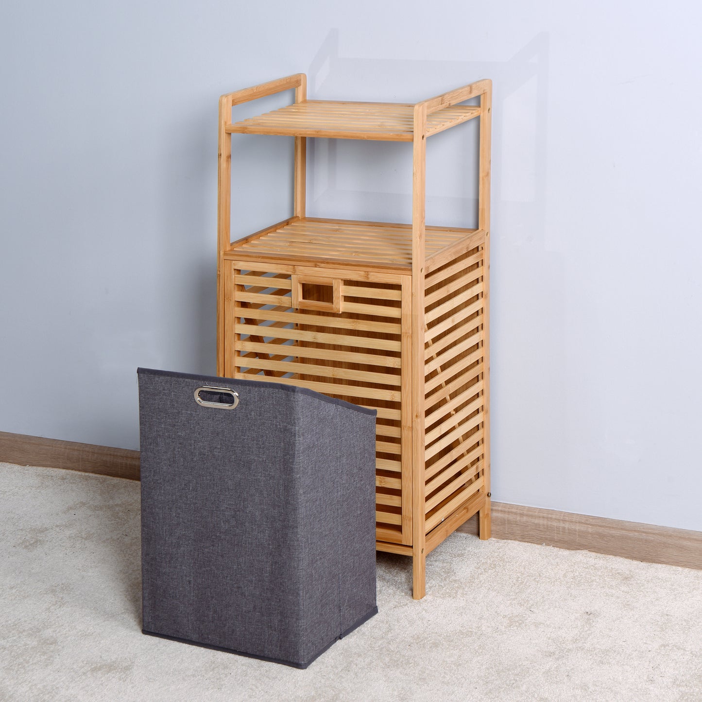 Bamboo slatted shelf unit with a grey fabric storage basket ideal for bathroom organization