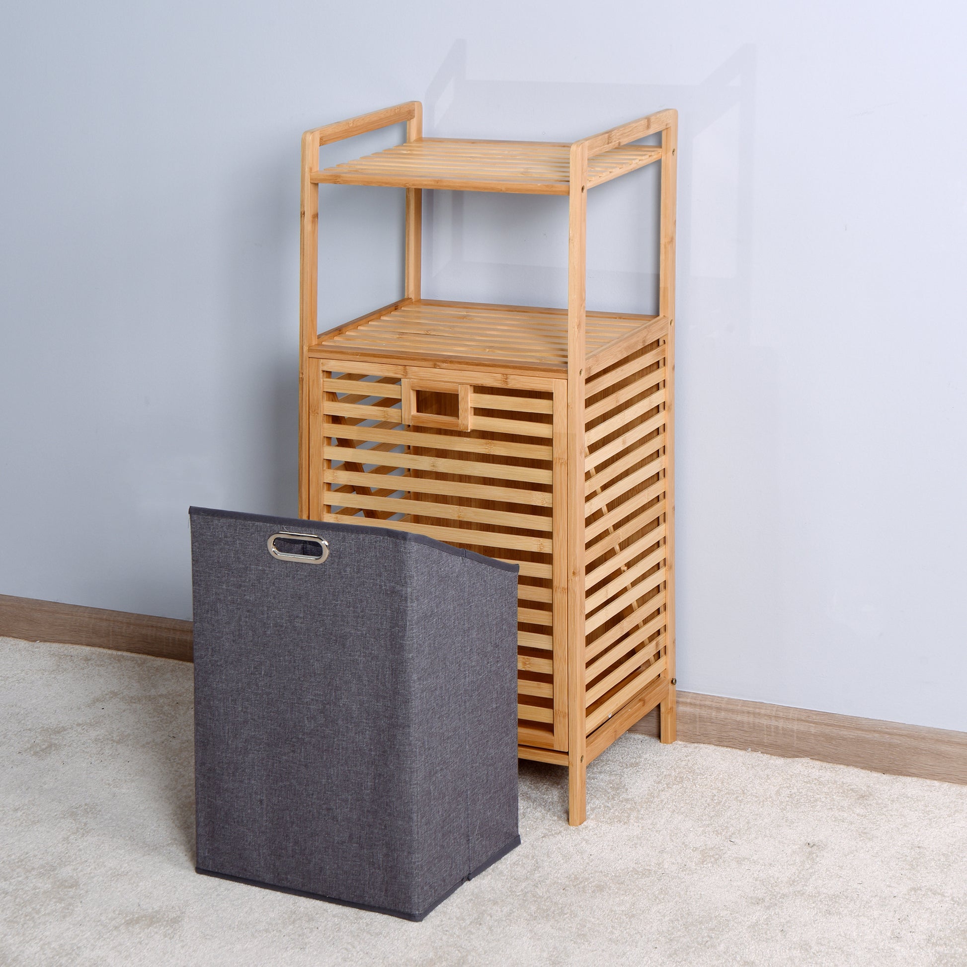 Bamboo slatted shelf unit with a grey fabric storage basket ideal for bathroom organization