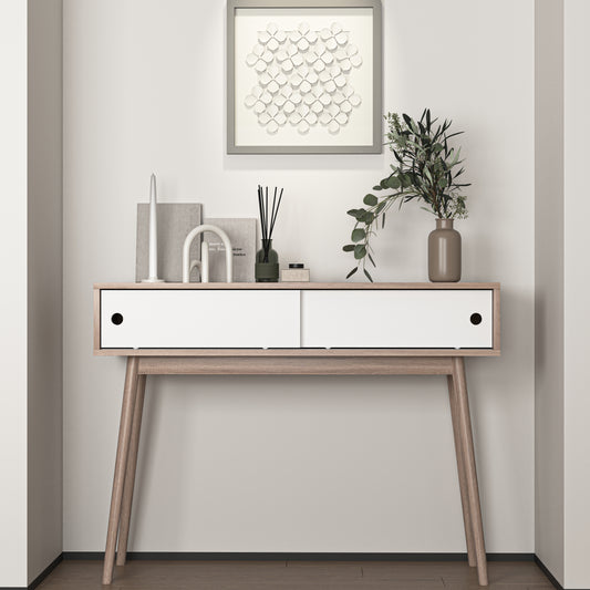 Modern light oak console table with white drawers featuring midcentury modern tapered legs