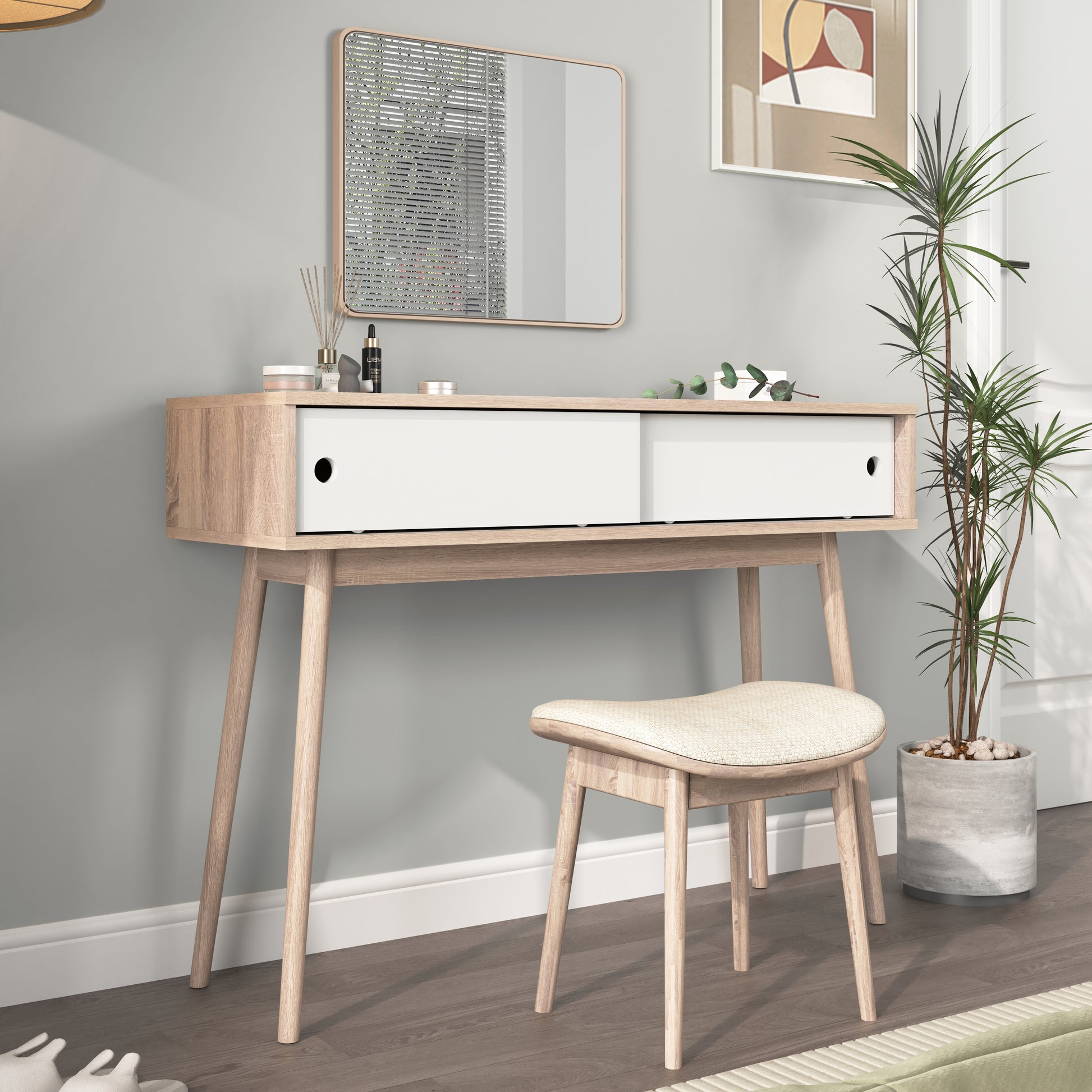 Light oak veneer dressing table with white drawer fronts and slender wooden legs
