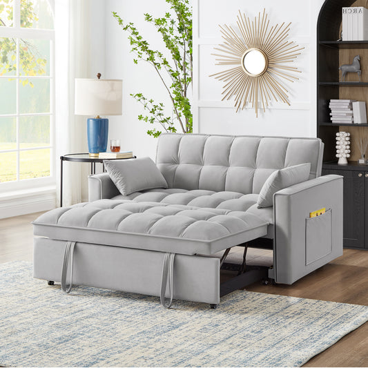 Light grey velvet sofa bed with tufted cushions and pullout mattress