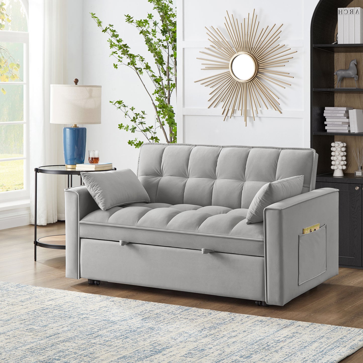 Tufted gray velvet sofa bed with hidden storage ideal for small spaces