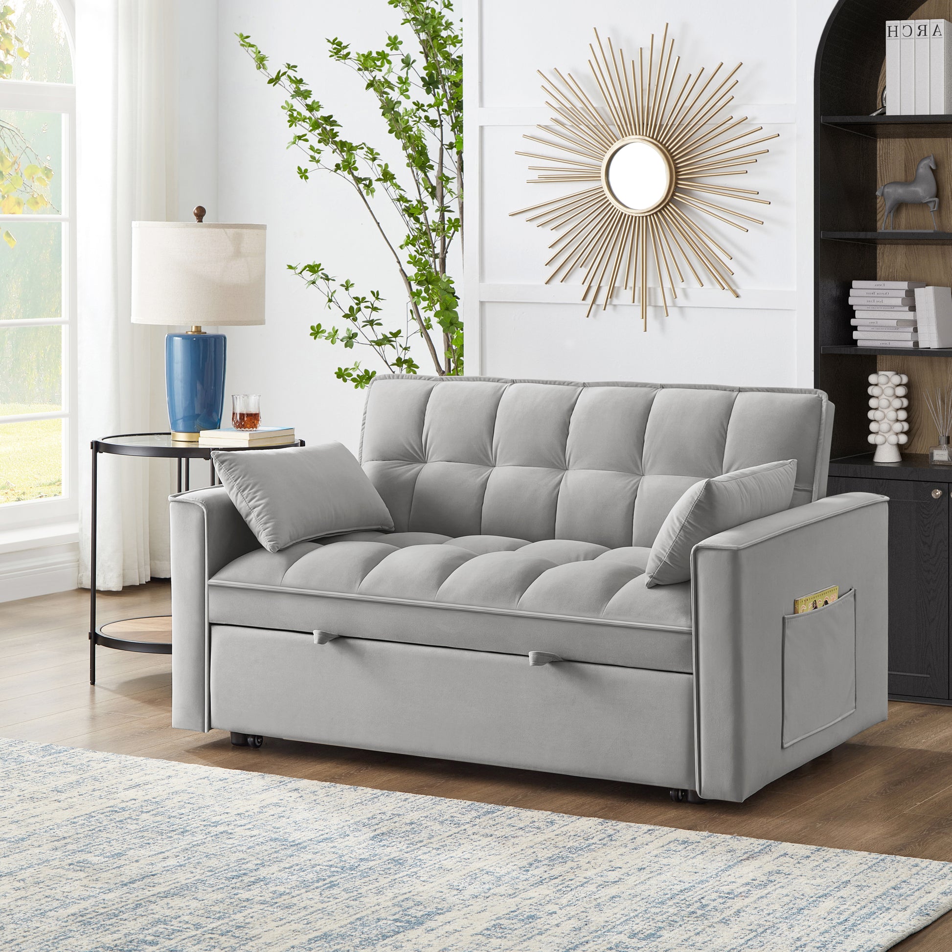 Tufted gray velvet sofa bed with hidden storage ideal for small spaces