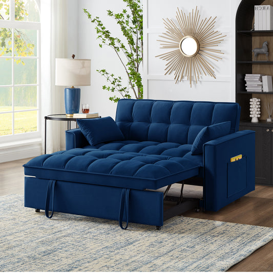 Navy blue velvet sofa bed with tufted cushions and storage armrest