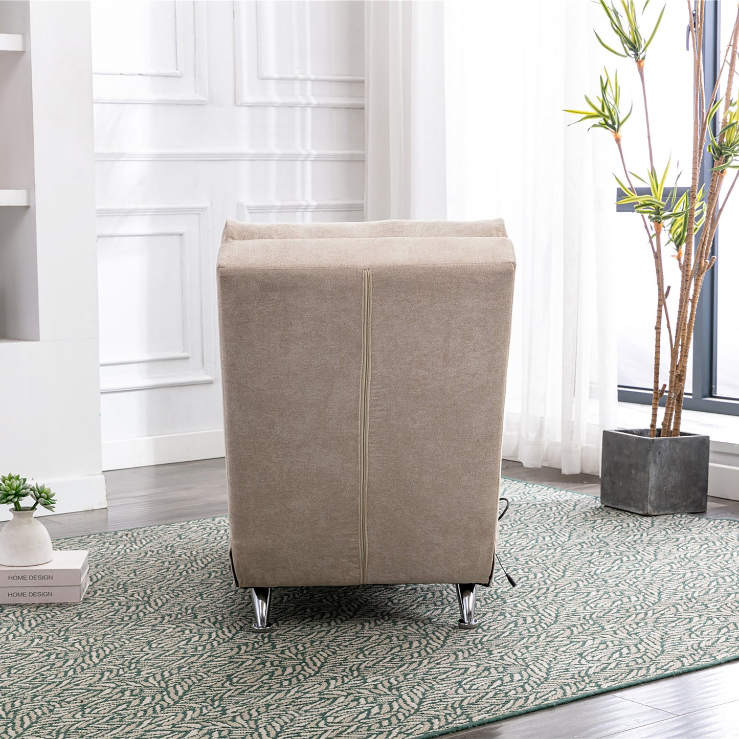 Cream upholstered accent chair with polished chrome legs shown from the back