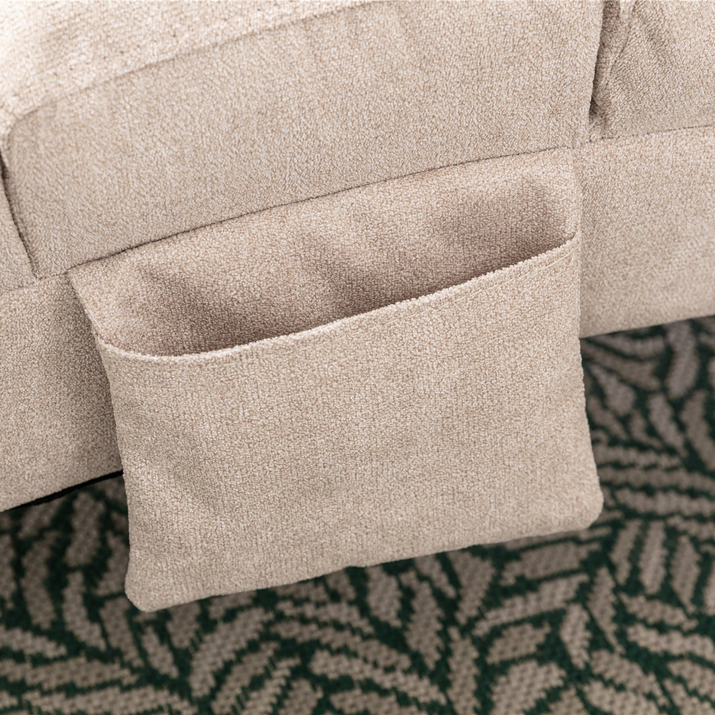 Beige fabric sofa with attached pocket organizer for remote control storage