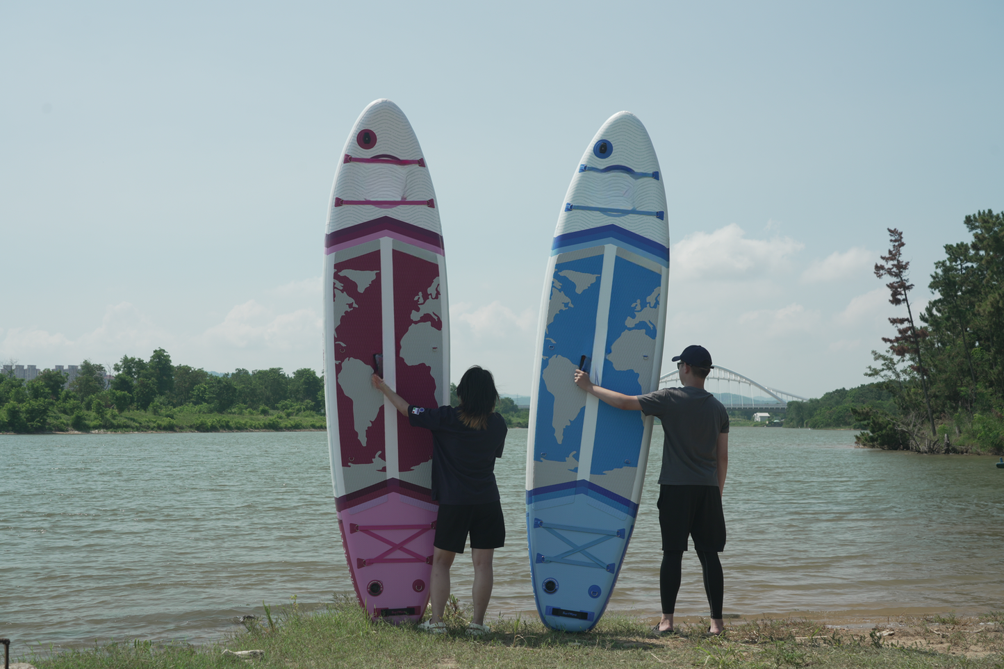 Inflatable stand up paddleboard with a pink world map design