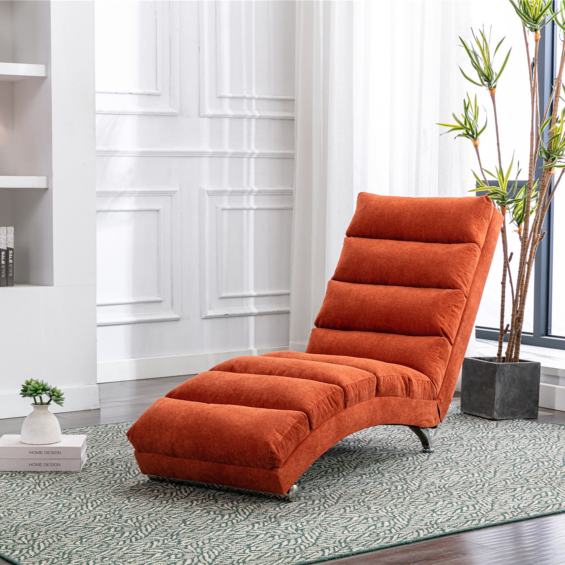 Orange fabric chaise lounge with tufted cushioning and metal legs perfect for modern living rooms
