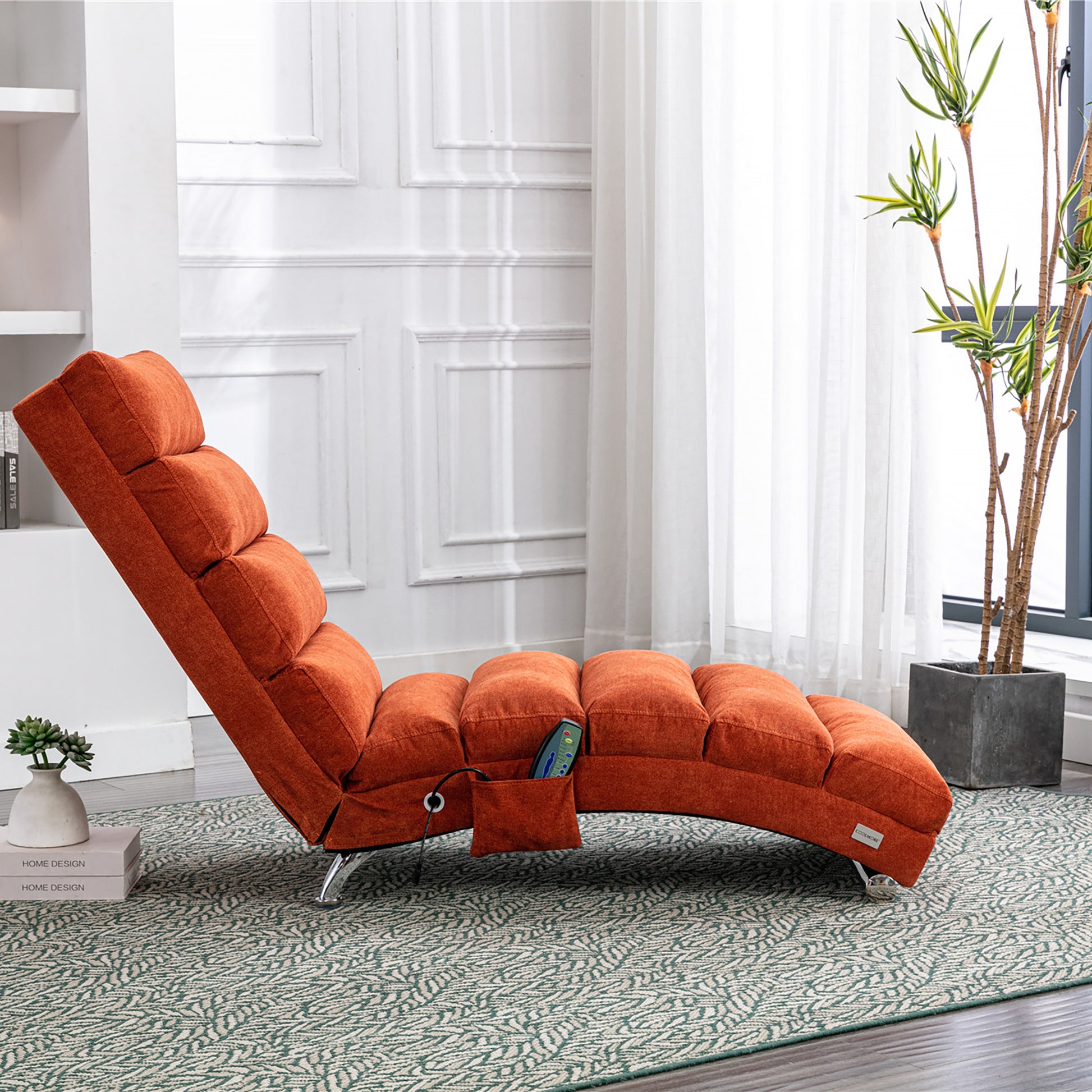 Adjustable orange chaise lounge chair with plush fabric and side pocket for remote