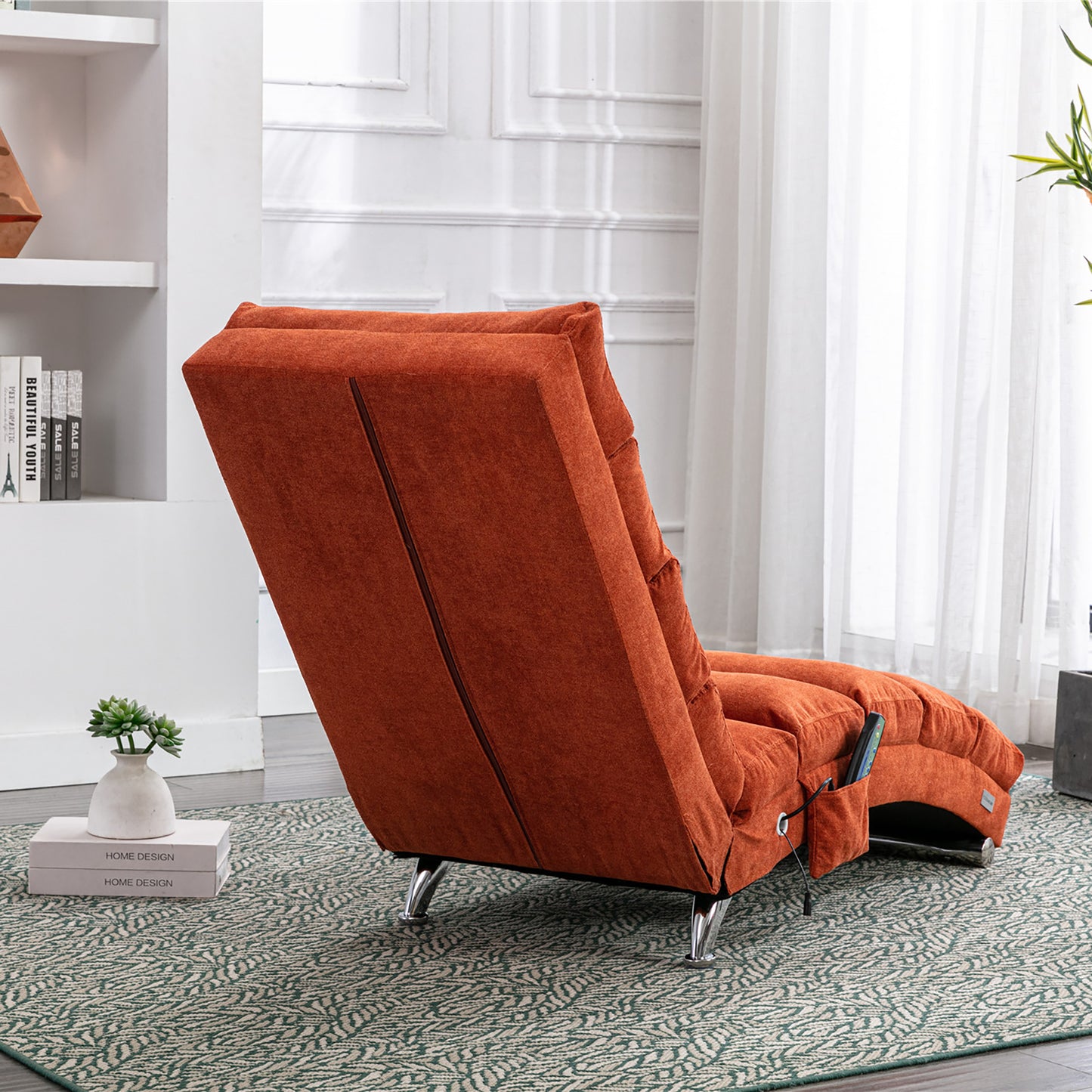 Orange fabric recliner chair with metal legs and remote control pocket