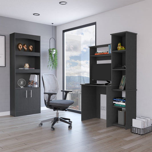 Dark gray office desk with integrated shelves holding a computer and books