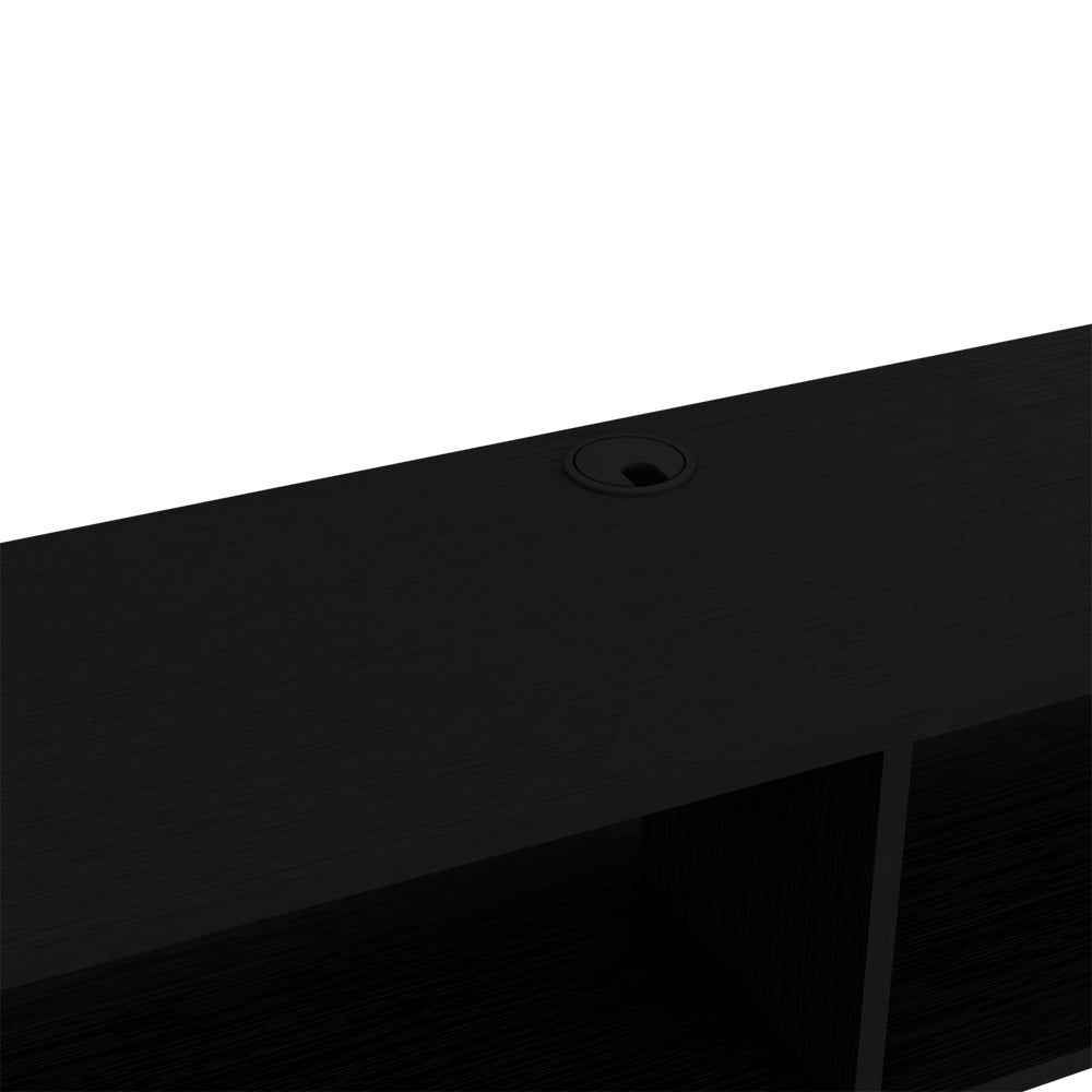 Black desk with integrated cable management grommet for a clean workspace