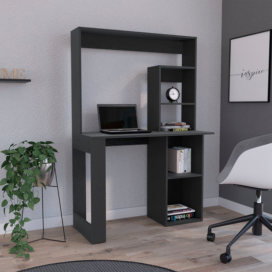 Dark grey modern computer desk with integrated shelving and laptop