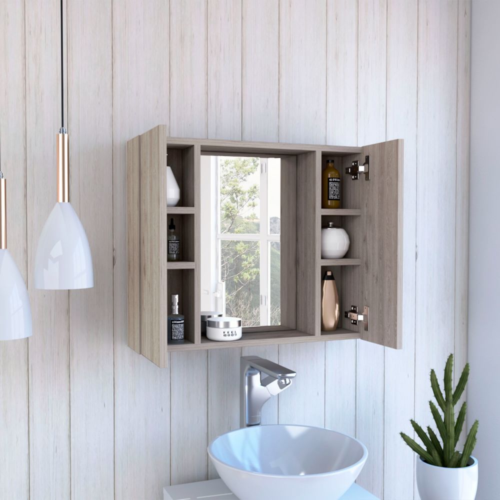 Gray wood medicine cabinet with open door and bathroom essentials