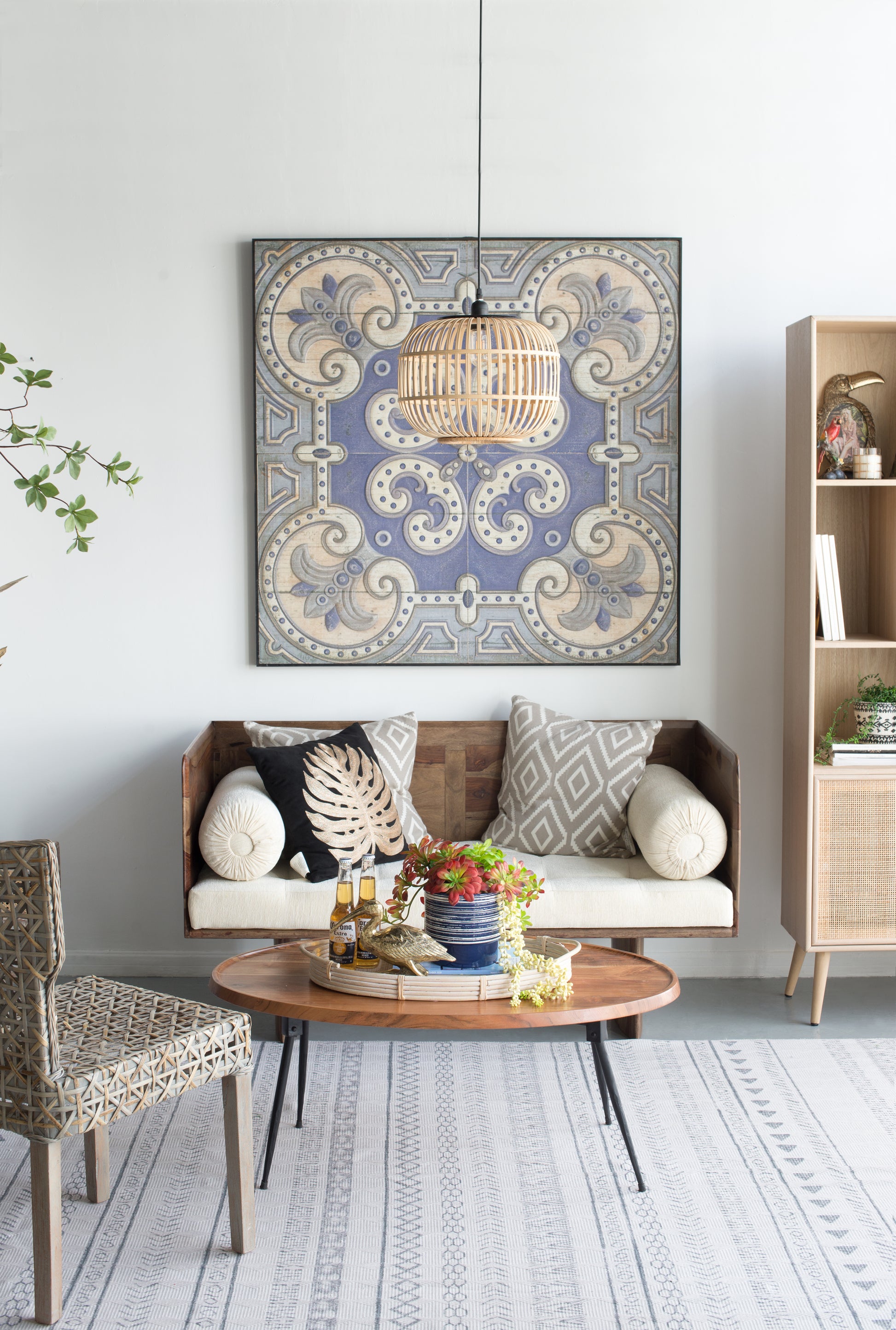 Decorative rattan pendant light with woven bamboo shade casting a warm glow in a living space