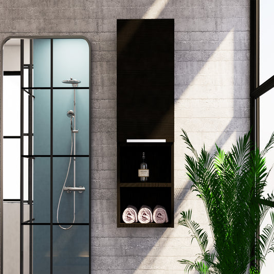 Modern black bathroom cabinet with open shelves holding rolled towels and argan oil