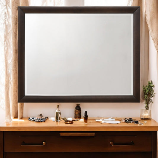 Dark wood framed vanity mirror with bevelled glass