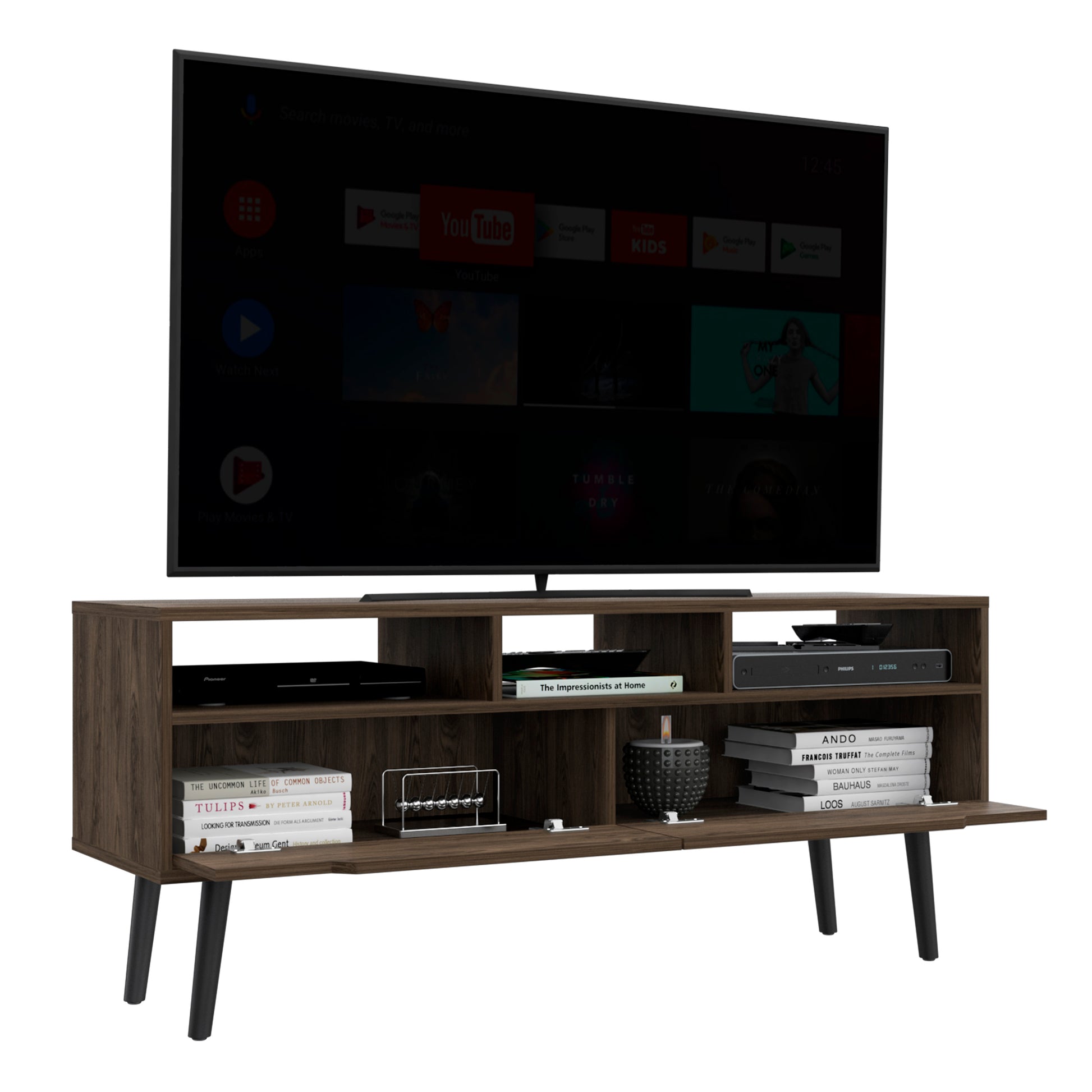 Dark wood TV stand with open shelves holding media devices and books