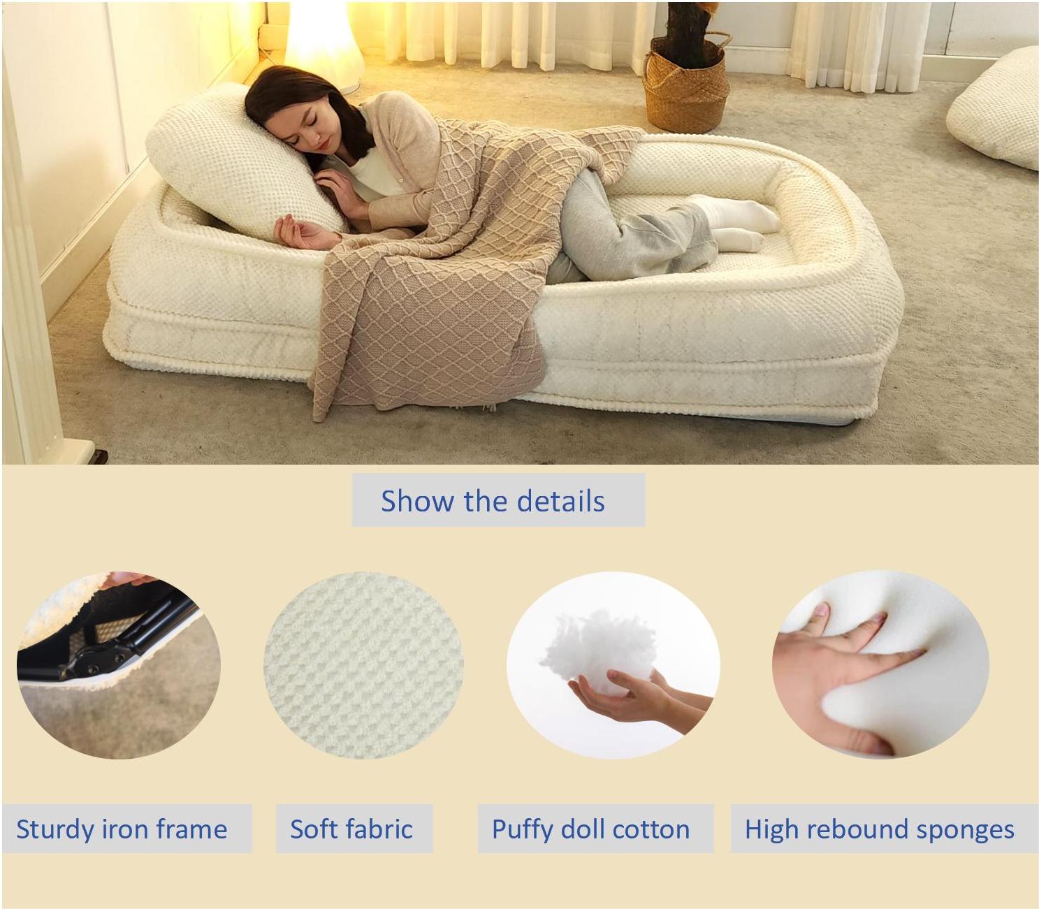 Woman sleeping on a plush creamcolored dog bed with a textured blanket