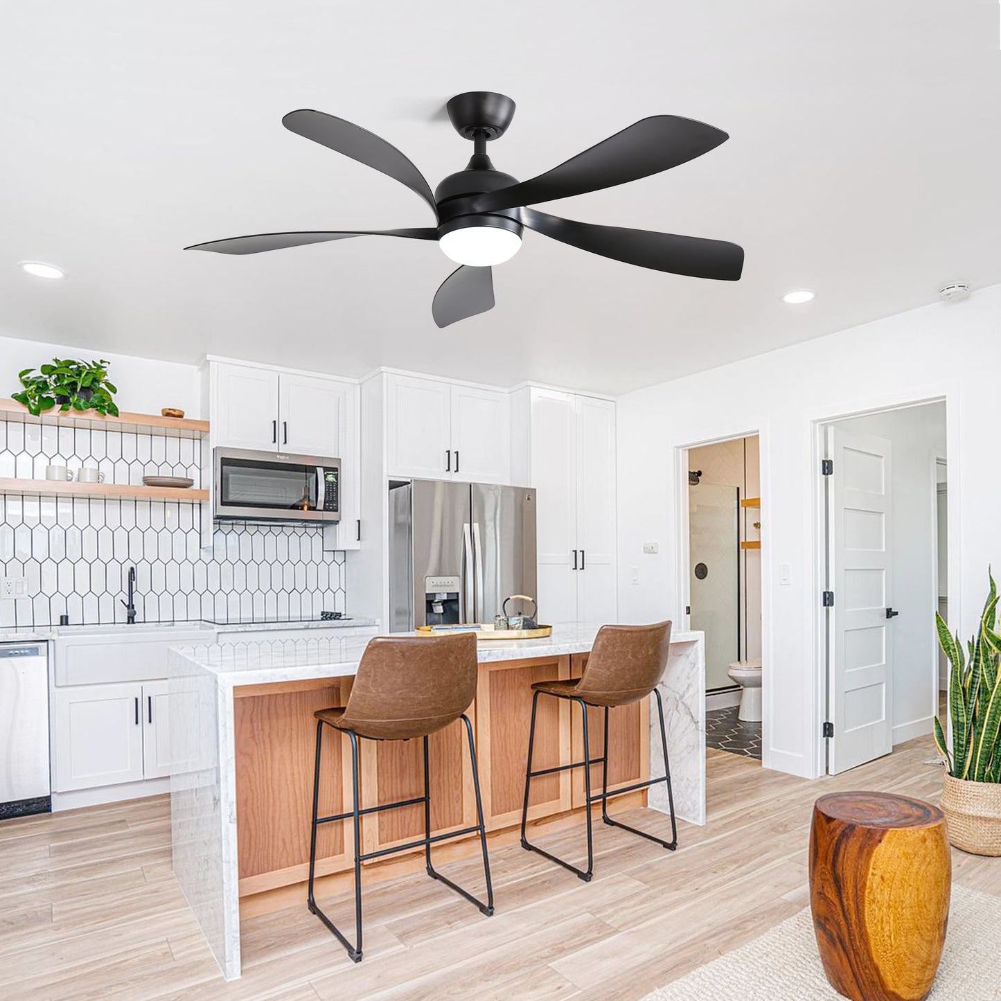 Black fiveblade ceiling fan with integrated LED light fixture in a modern kitchen