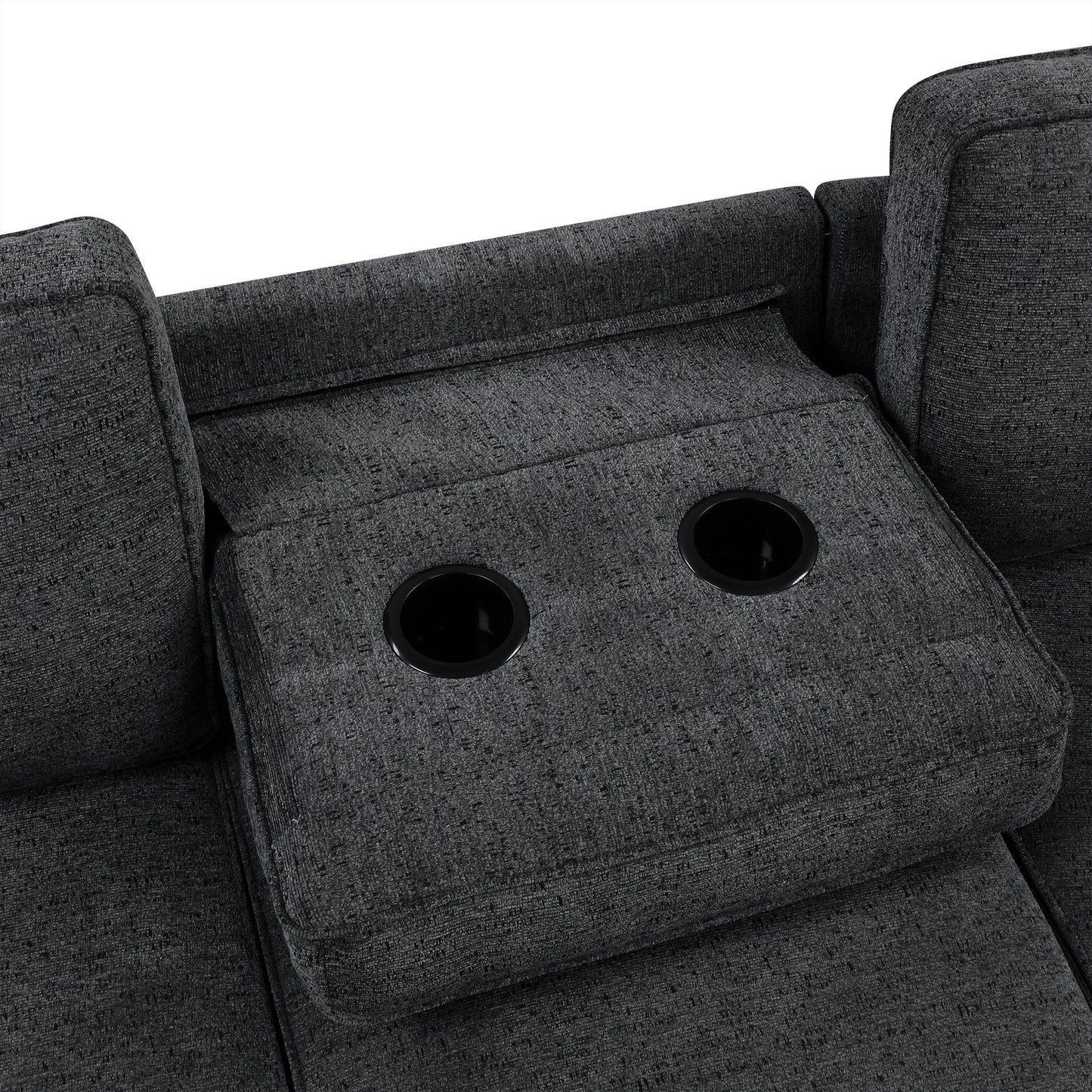 Closeup of a dark gray fabric sofa armrest with two integrated cup holders
