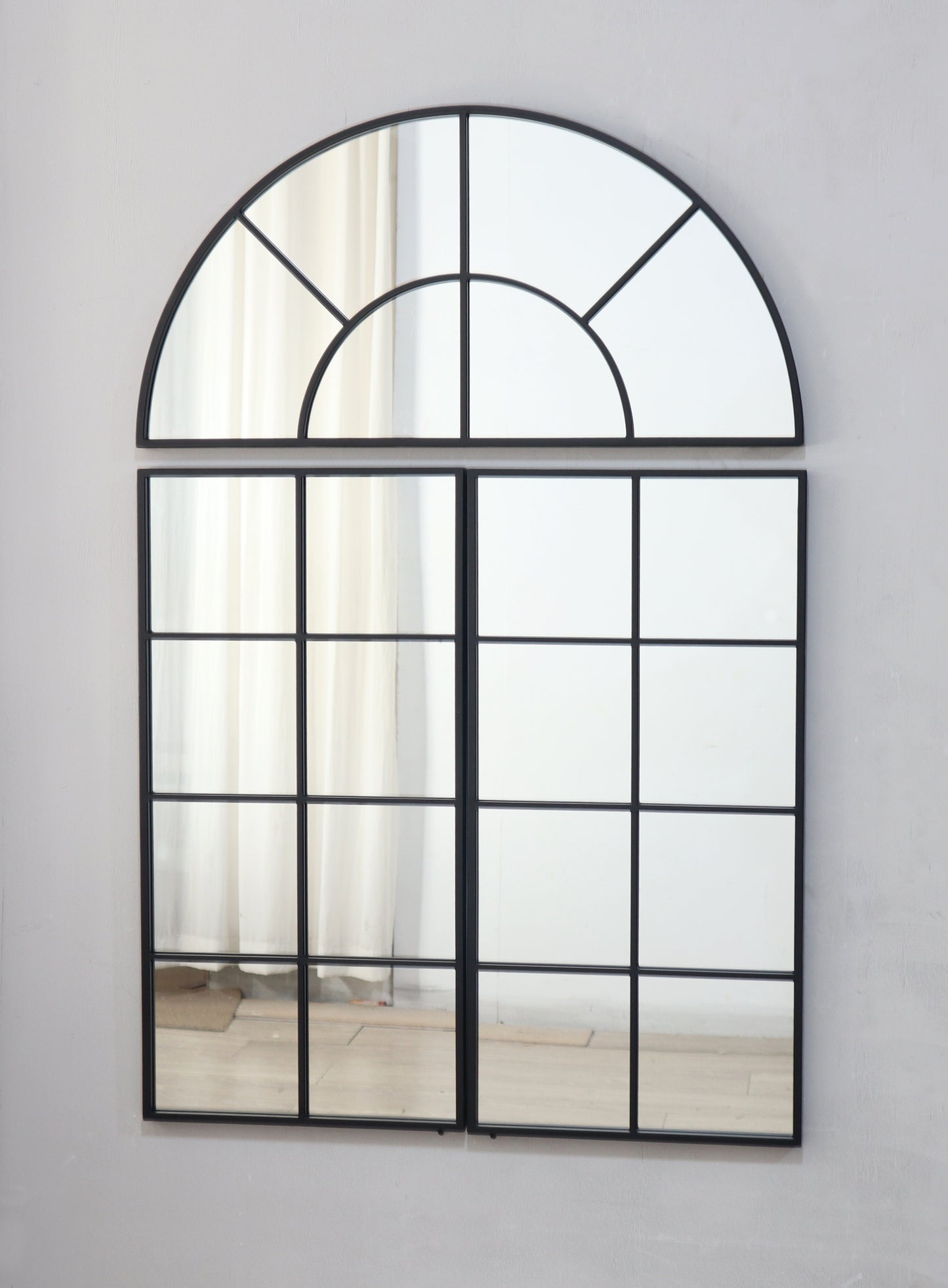 Arched top black metal frame mirror with multiple panes