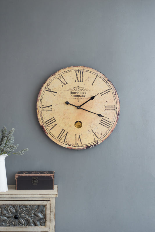 Vintage wall clock with Roman numerals and pendulum detail