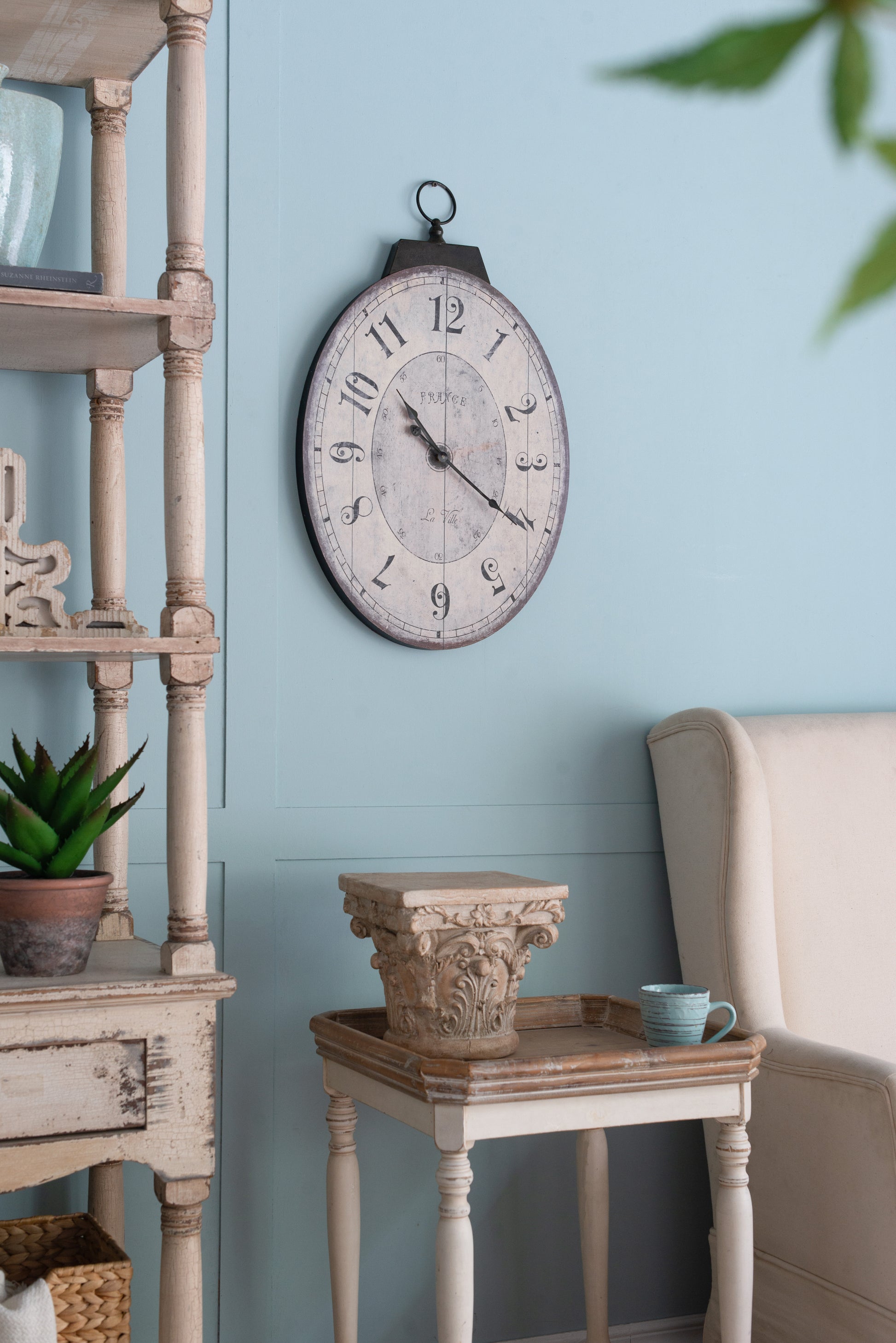 Round wall clock with French text and Roman numerals perfect for vintage decor