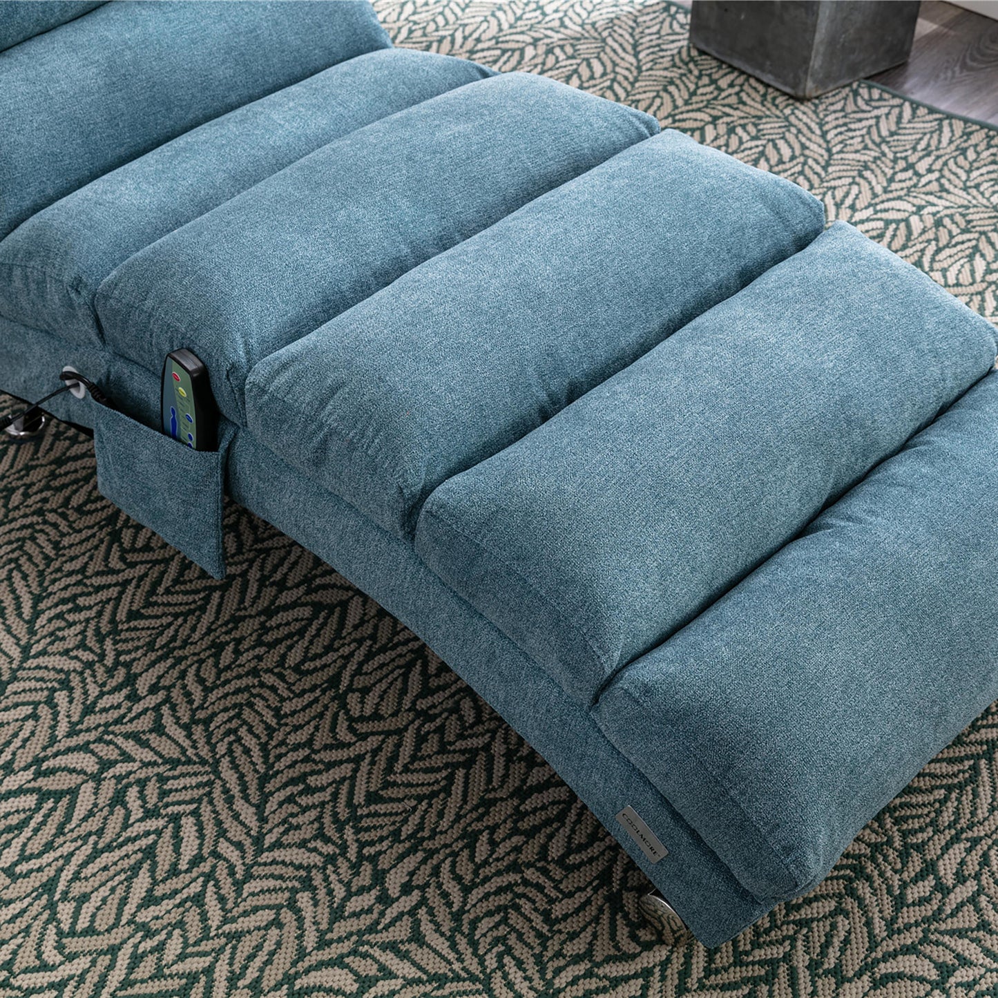 Comfortable blue fabric chaise lounge with recliner control in side pocket