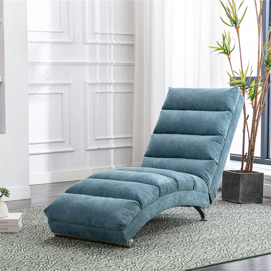 Teal upholstered chaise lounge chair with quilted cushions and chrome legs