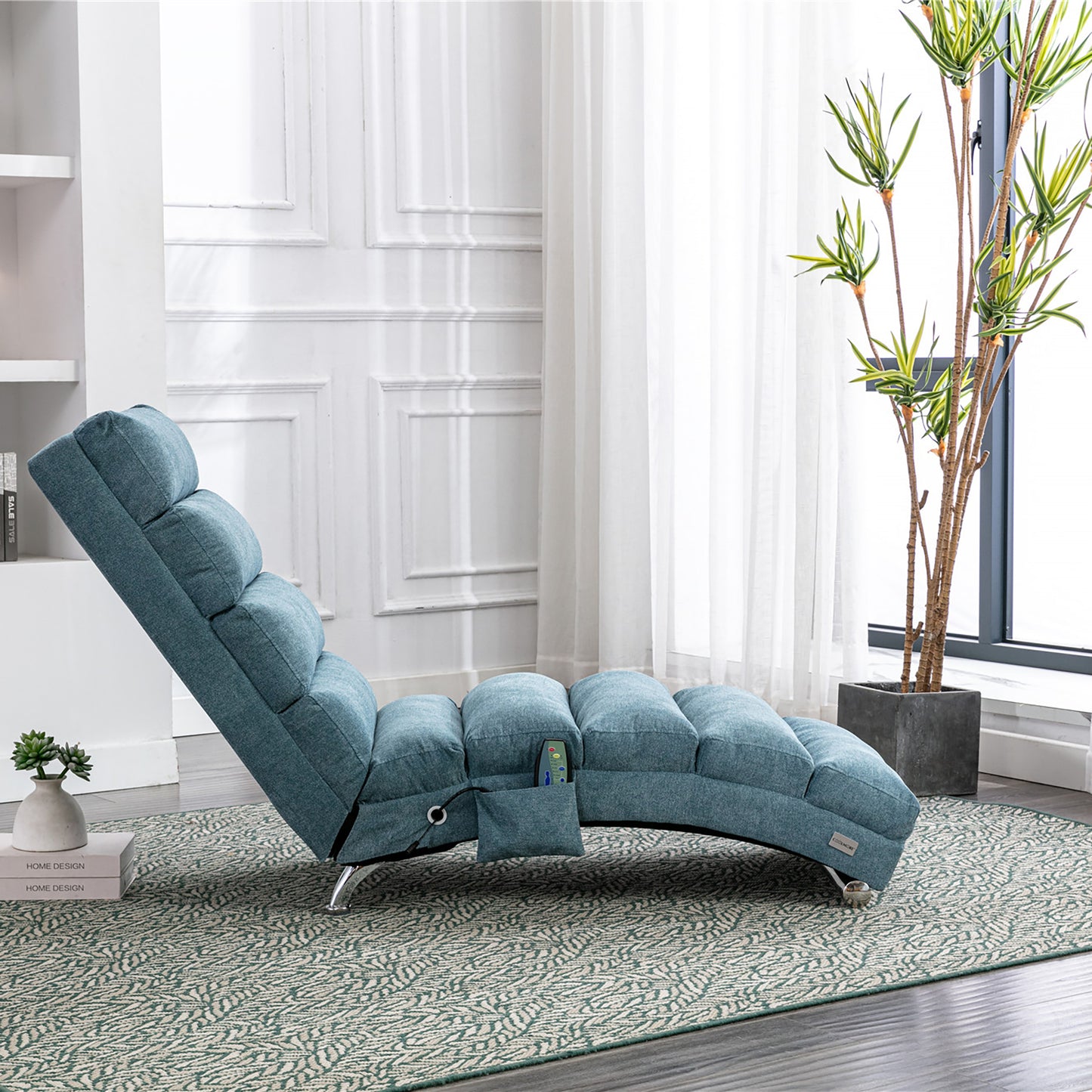 Teal fabric chaise lounge chair with plush cushions and a side pocket for relaxation