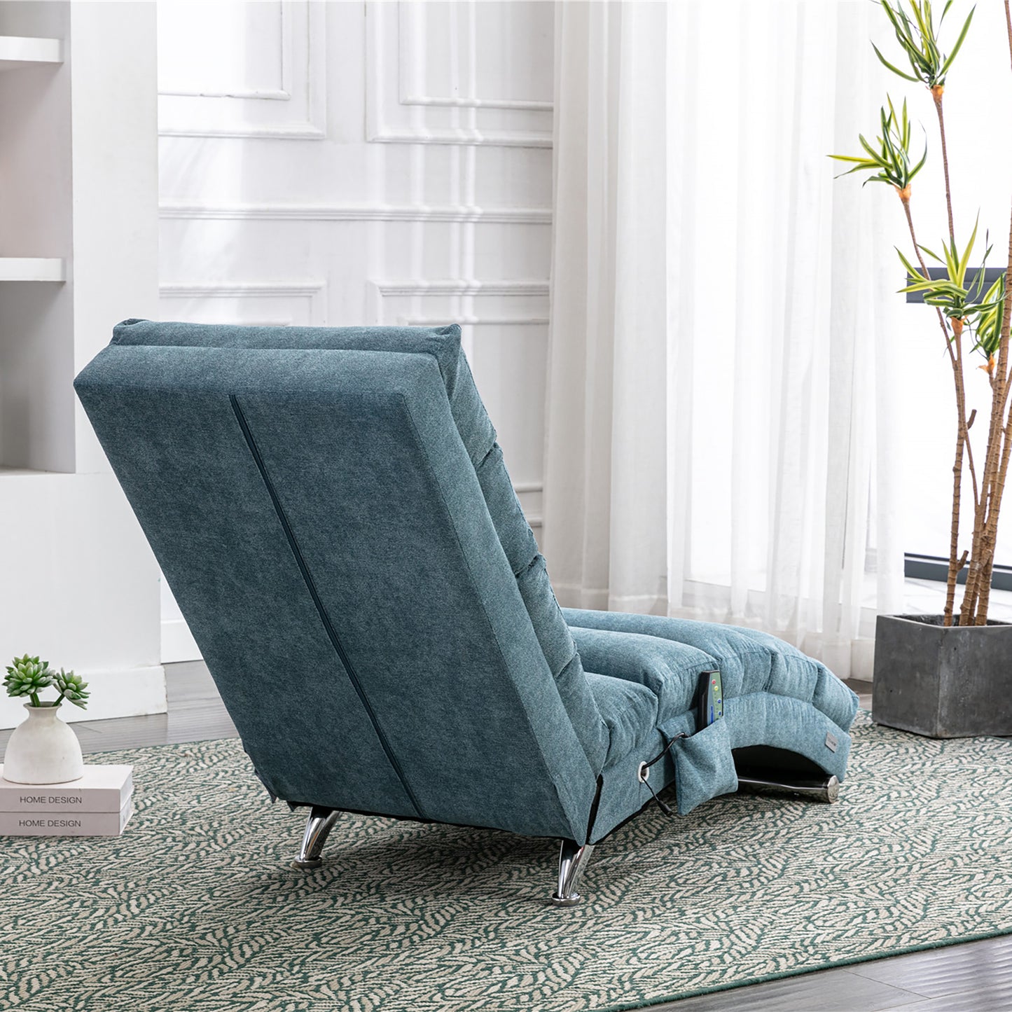 Teal fabric recliner chair with chrome legs in a living room setting