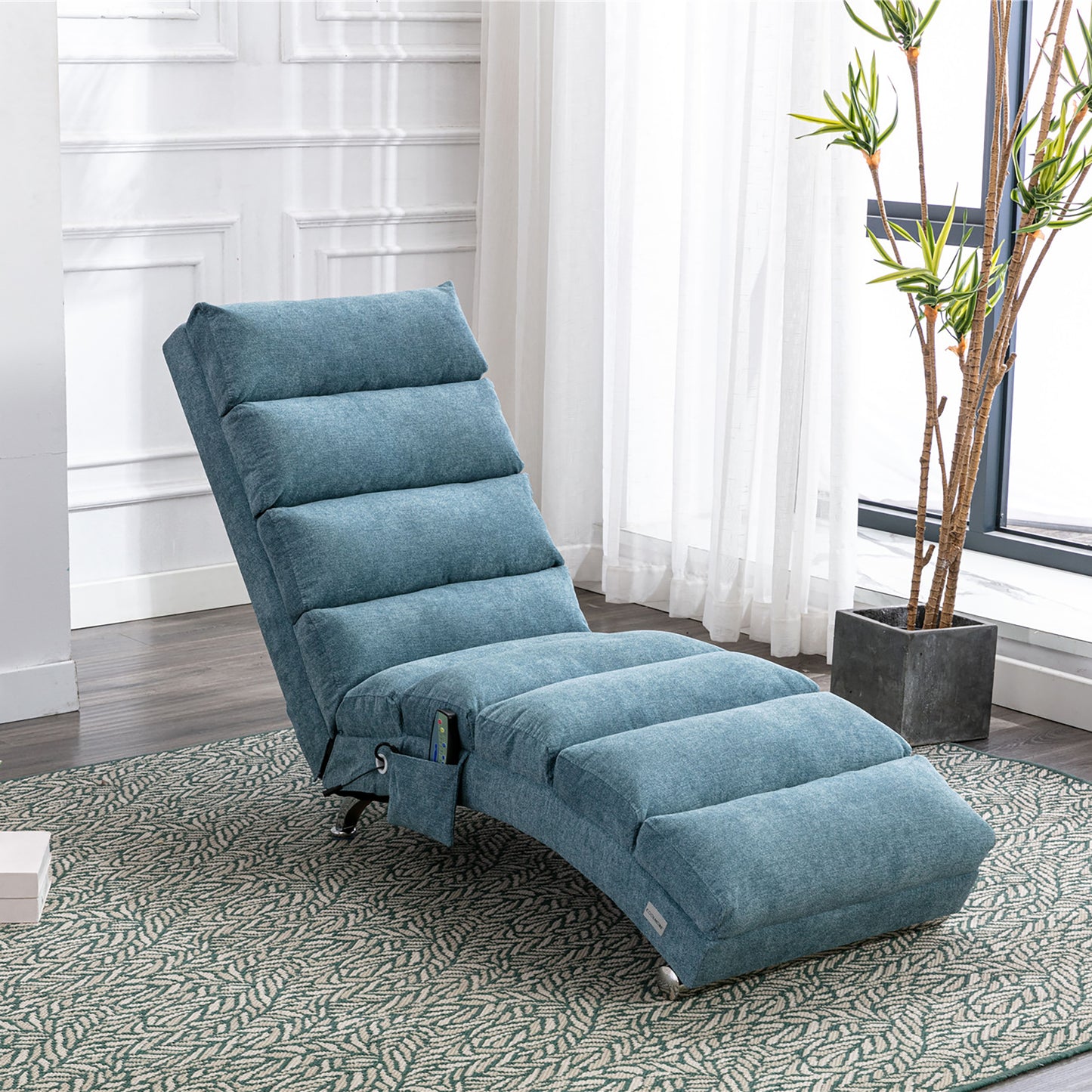 Plush blue fabric recliner chair with adjustable headrest and footrest on a patterned rug