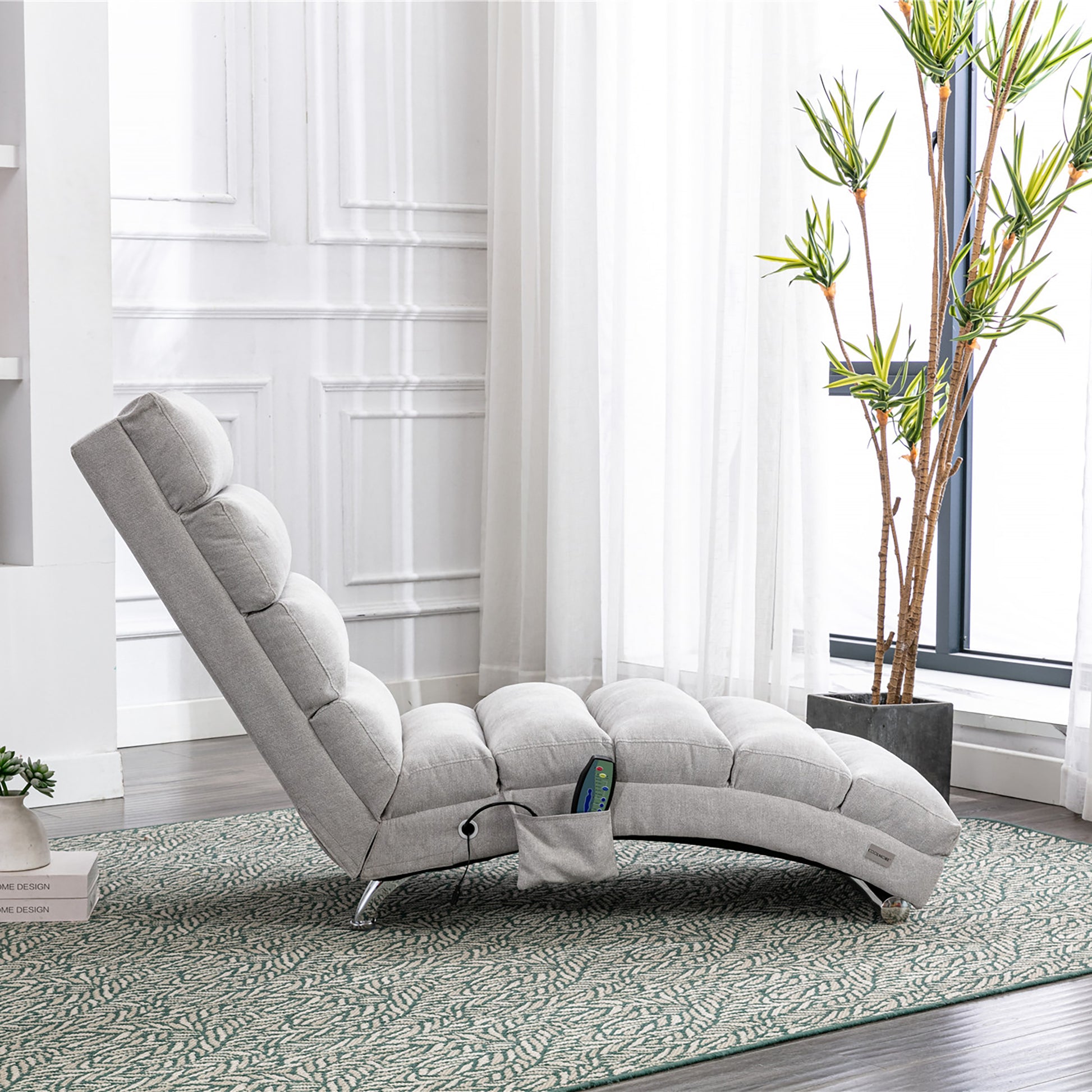 Gray fabric chaise lounge with tufted cushioning and recliner controls