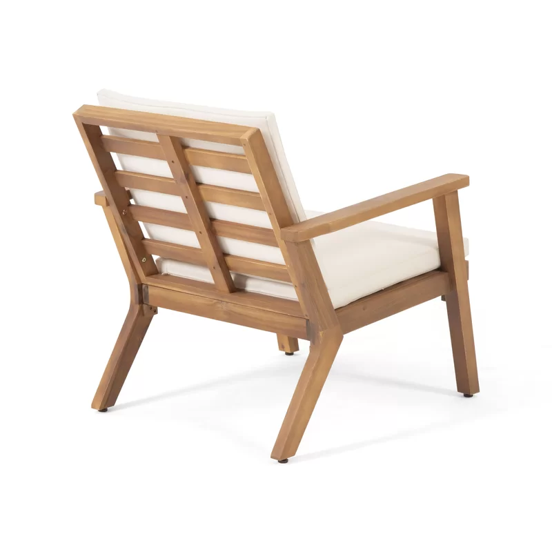 Acacia wood patio chair with slatted back and cream cushion