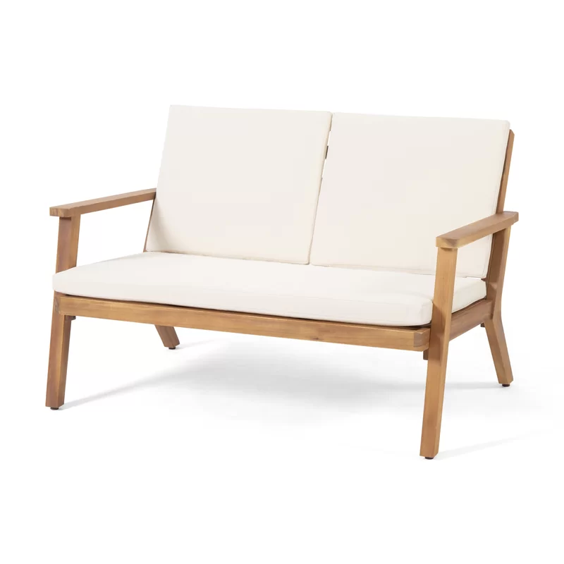 Acacia wood outdoor loveseat with plush offwhite cushions perfect for patio relaxation