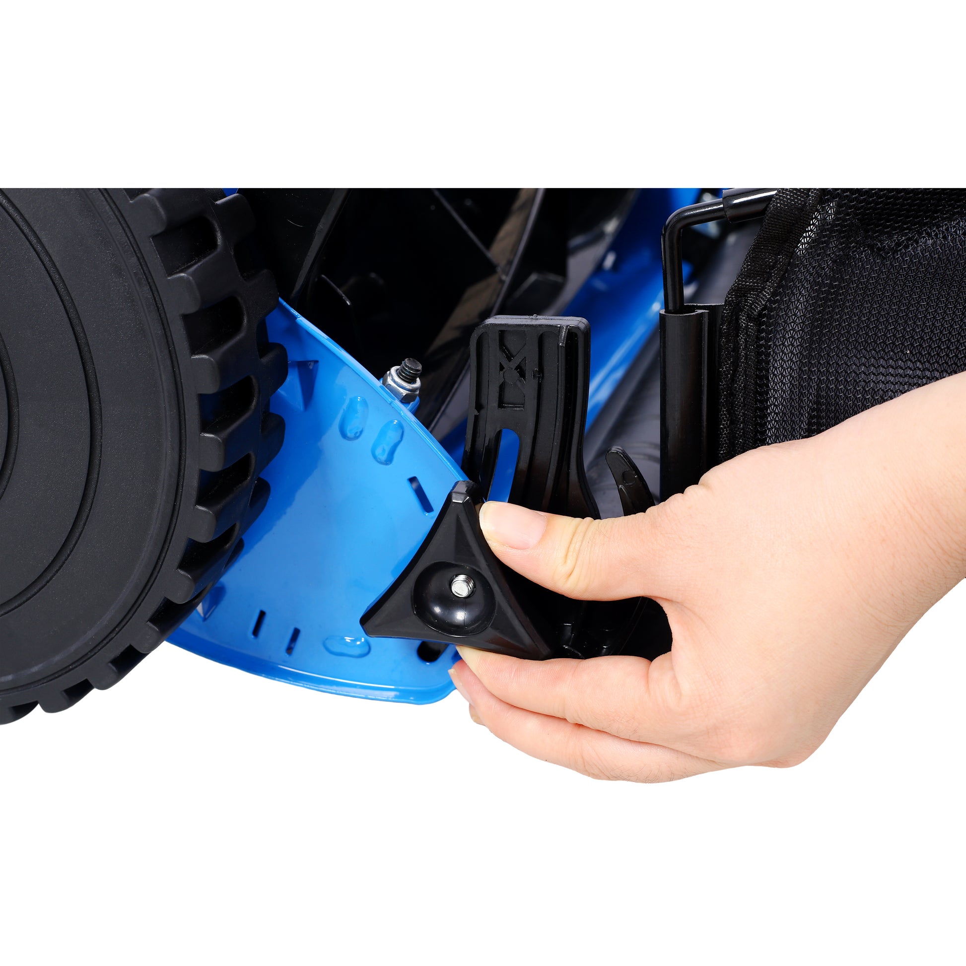 Closeup of a blue lawn mower assembly showing a hand adjusting a black plastic component near the wheel