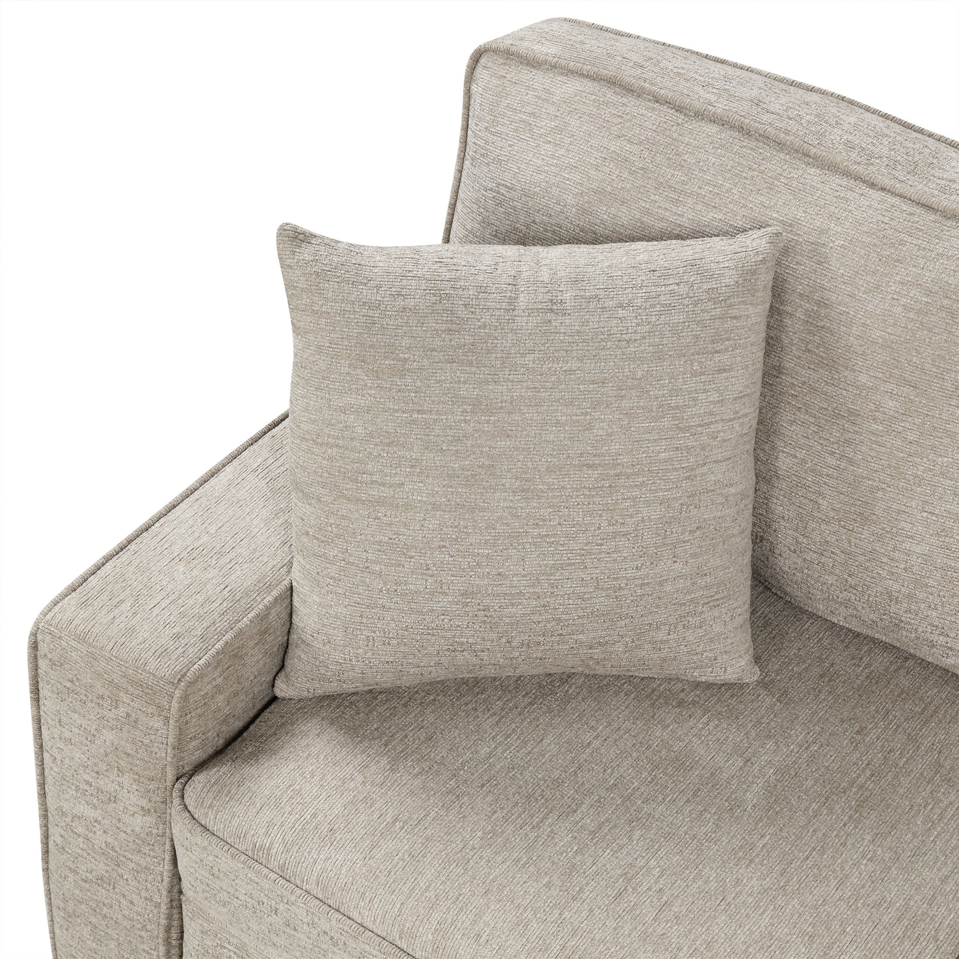 Closeup of a textured beige throw pillow on a matching sofa