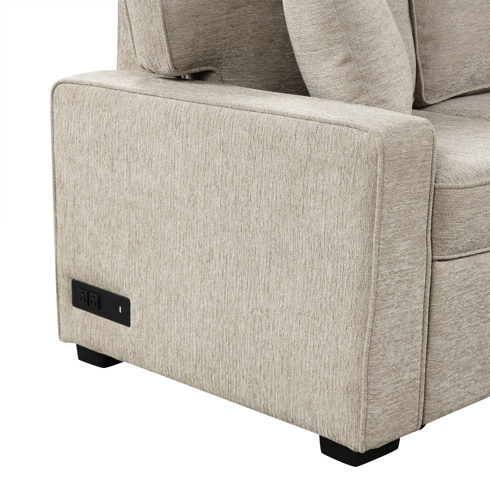 Beige textured fabric sofa arm with integrated power outlets and USB port