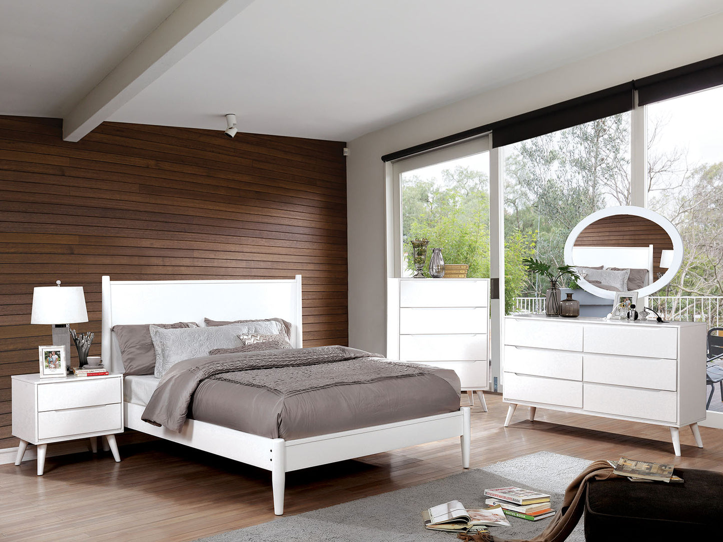 Modern white platform bed with upholstered headboard and dark grey bedding