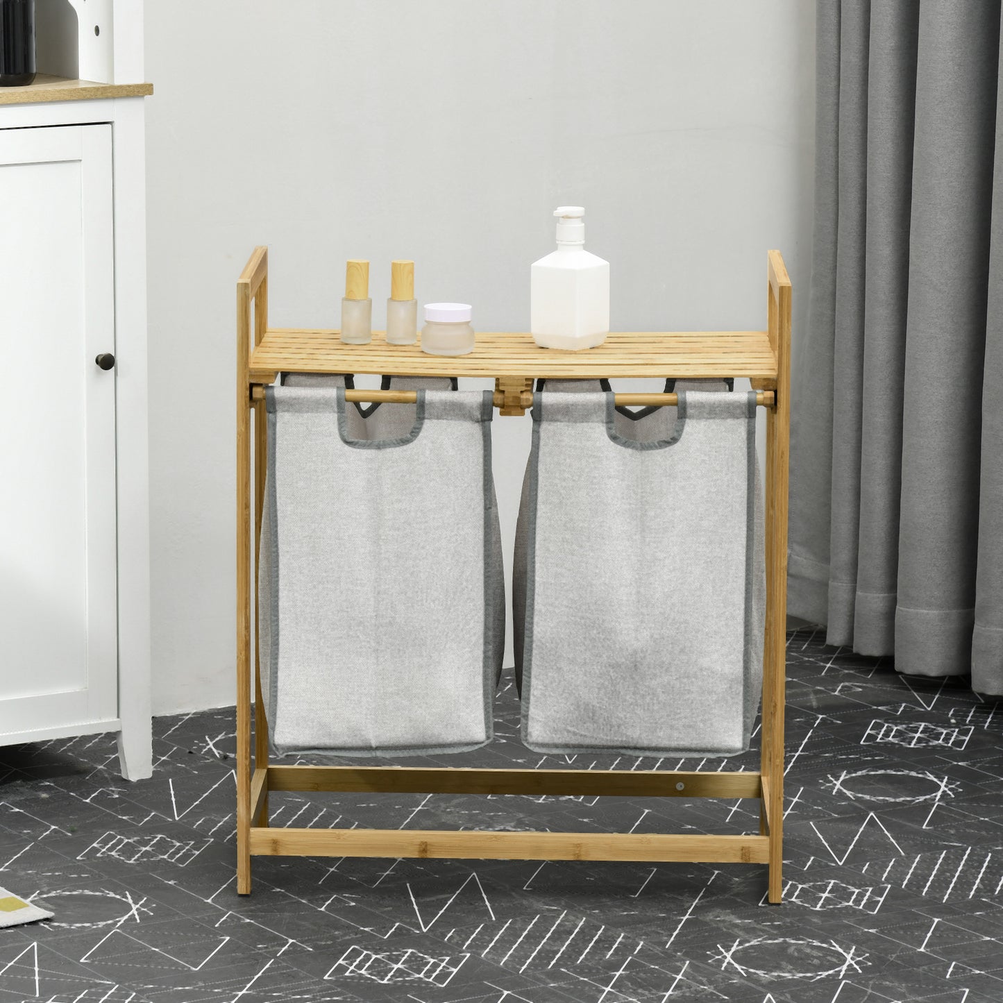 Bamboo double laundry hamper with removable gray fabric bags and top shelf for storage