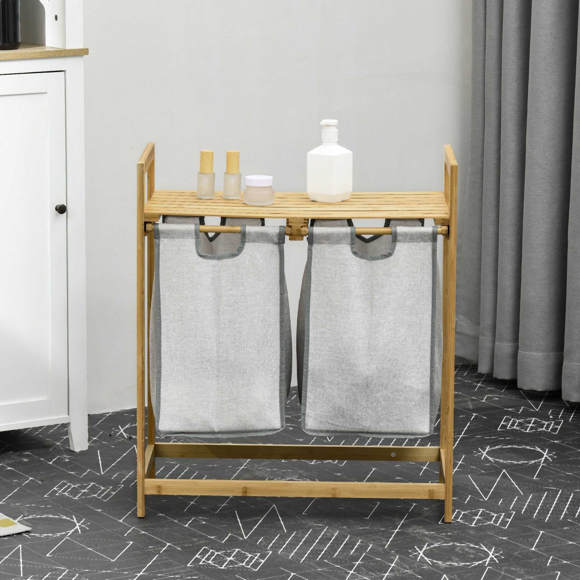 Bamboo double laundry hamper with removable gray fabric bags and top shelf for storage