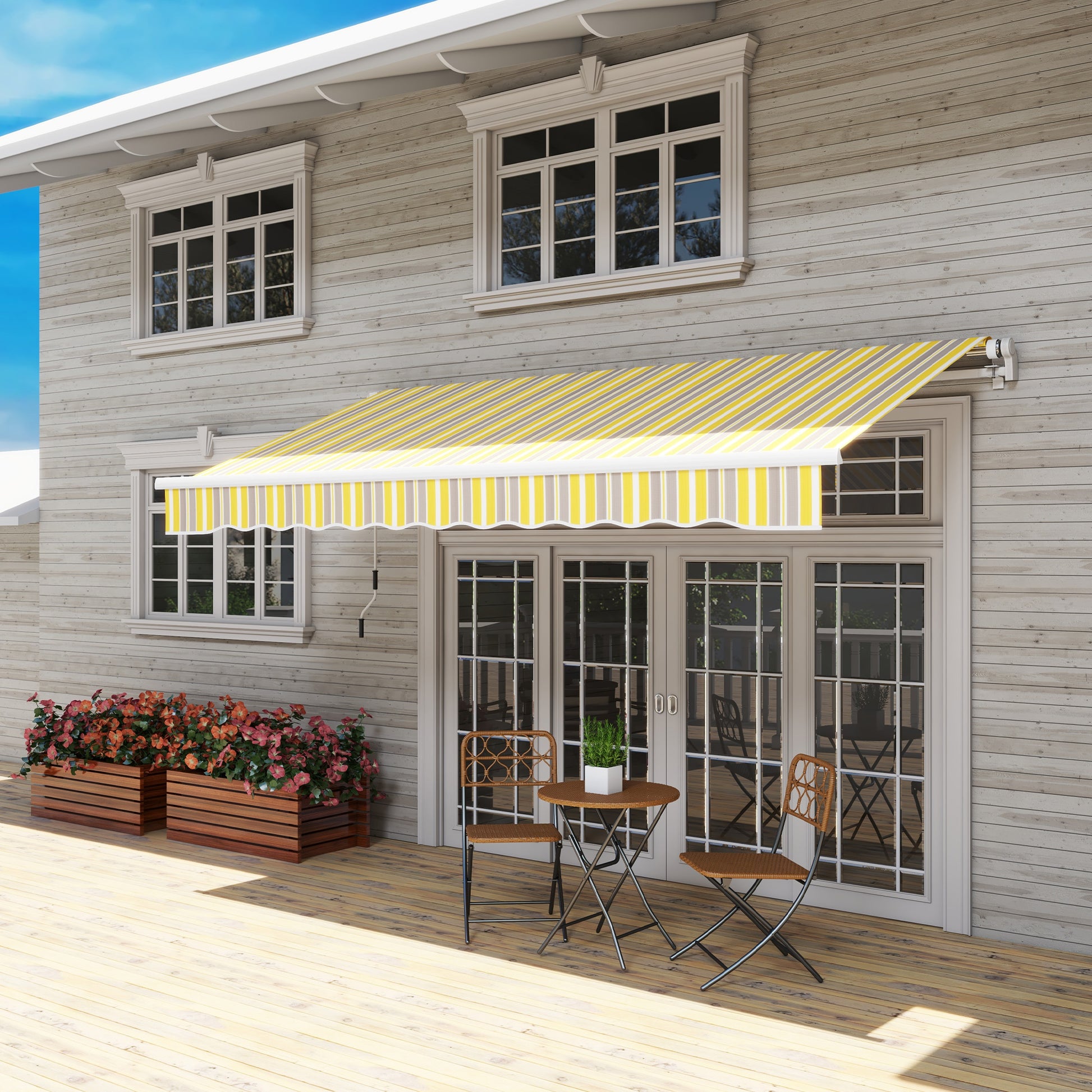 Striped retractable patio awning in yellow grey and white for outdoor shade