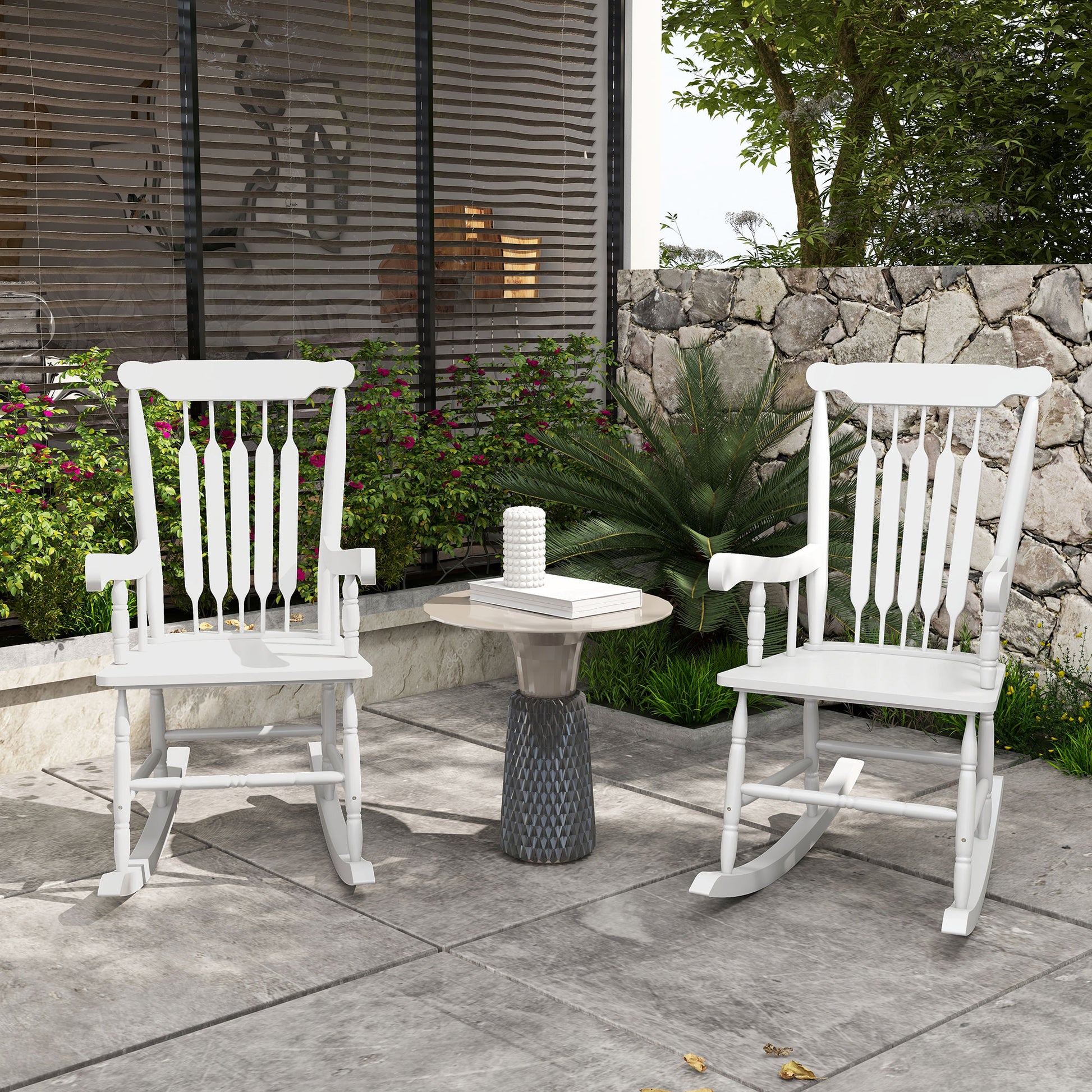 Classic white wooden rocking chair with spindle back for outdoor relaxation