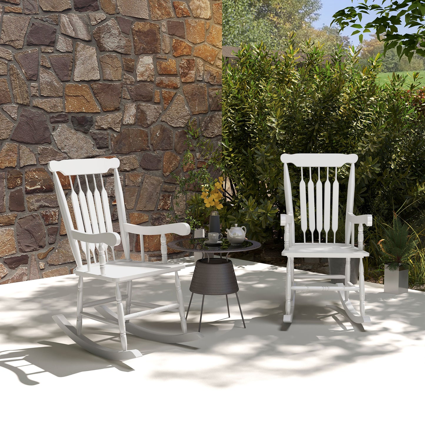 White wooden rocking chair with classic spindle back perfect for garden relaxation